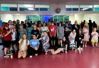 Group photo of MASH (Mainstream Adults Sharing Hope) members at the John Geigle YMCA.