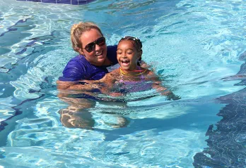 Instructor and child in pool for SAW
