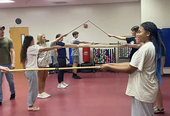 Students participating in the Stick Club at the John Geigle YMCA
