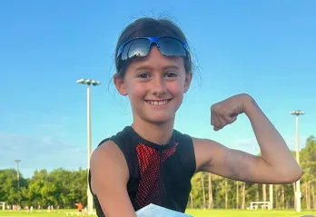 Youth participant in Kids Triathlon at the Greater Palm Harbor YMCA