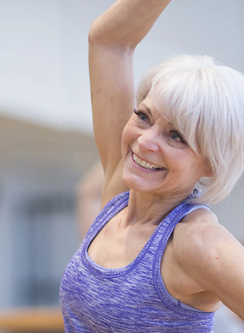 active older woman enjoying low impact small group exercise
