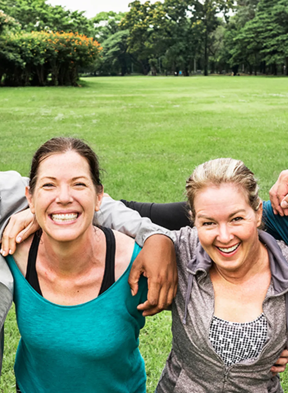 diverse group taking a break from outdoor fitness for a photo