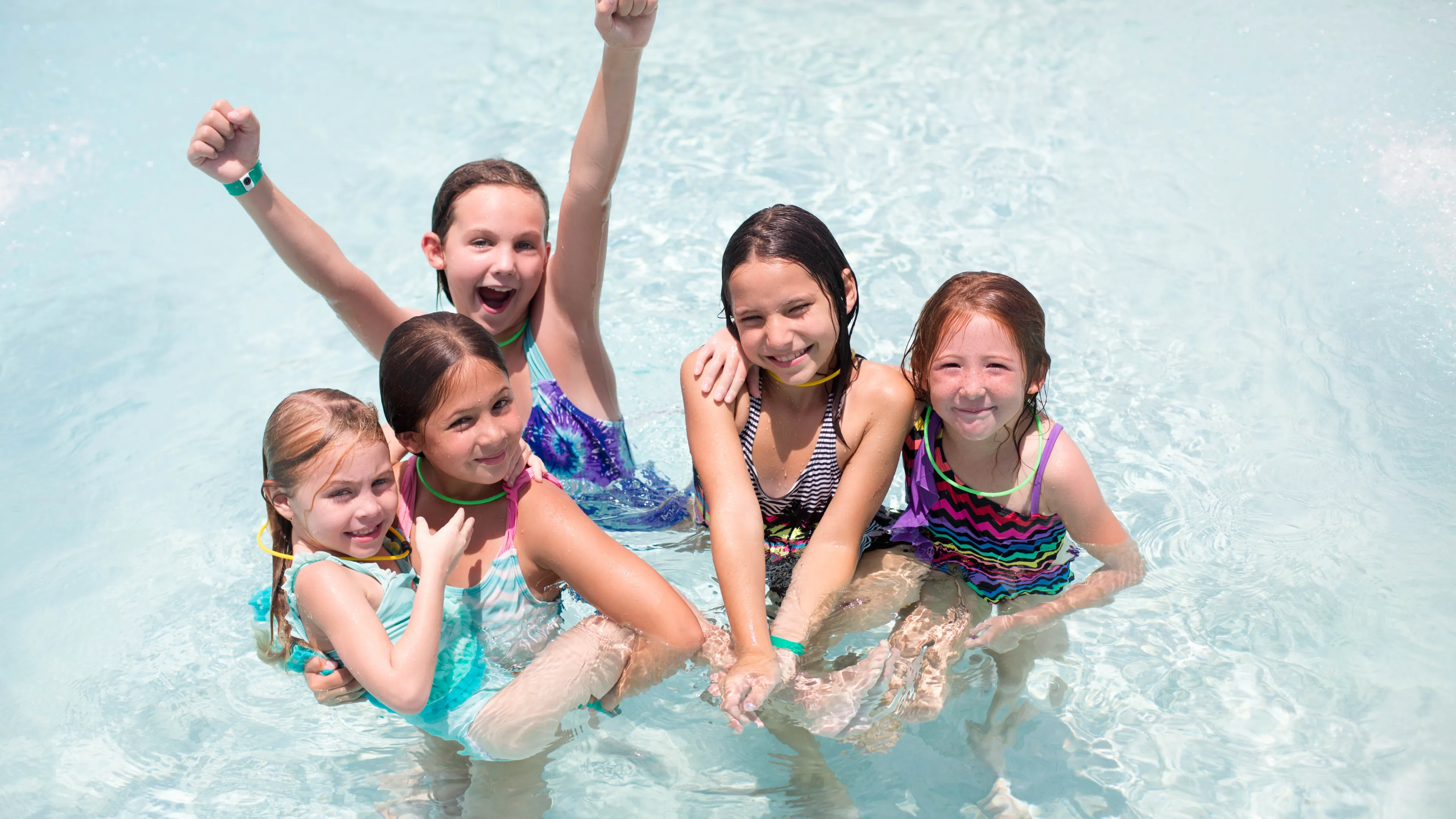 summer campers in pool