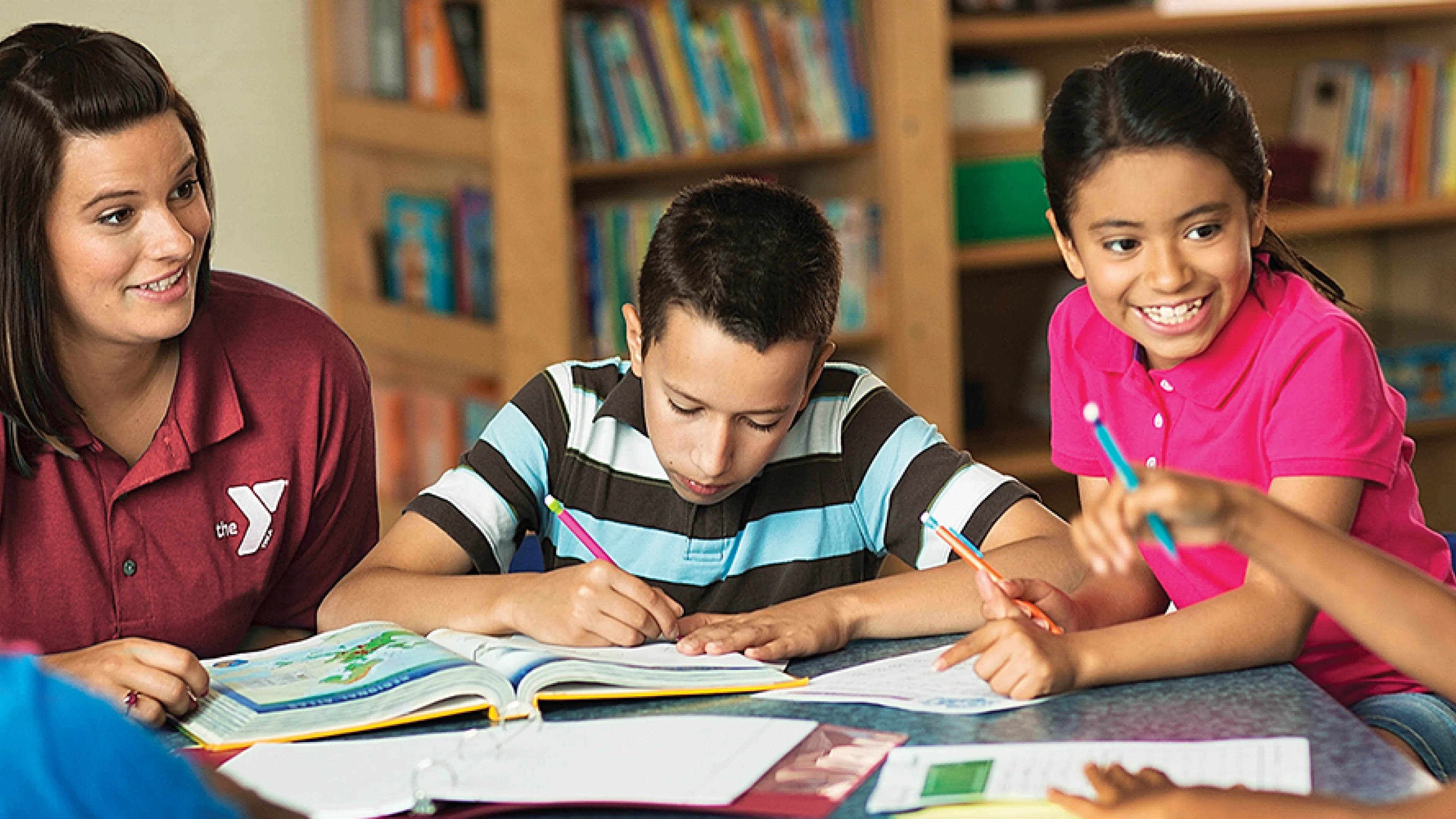 teacher helping kids with homework