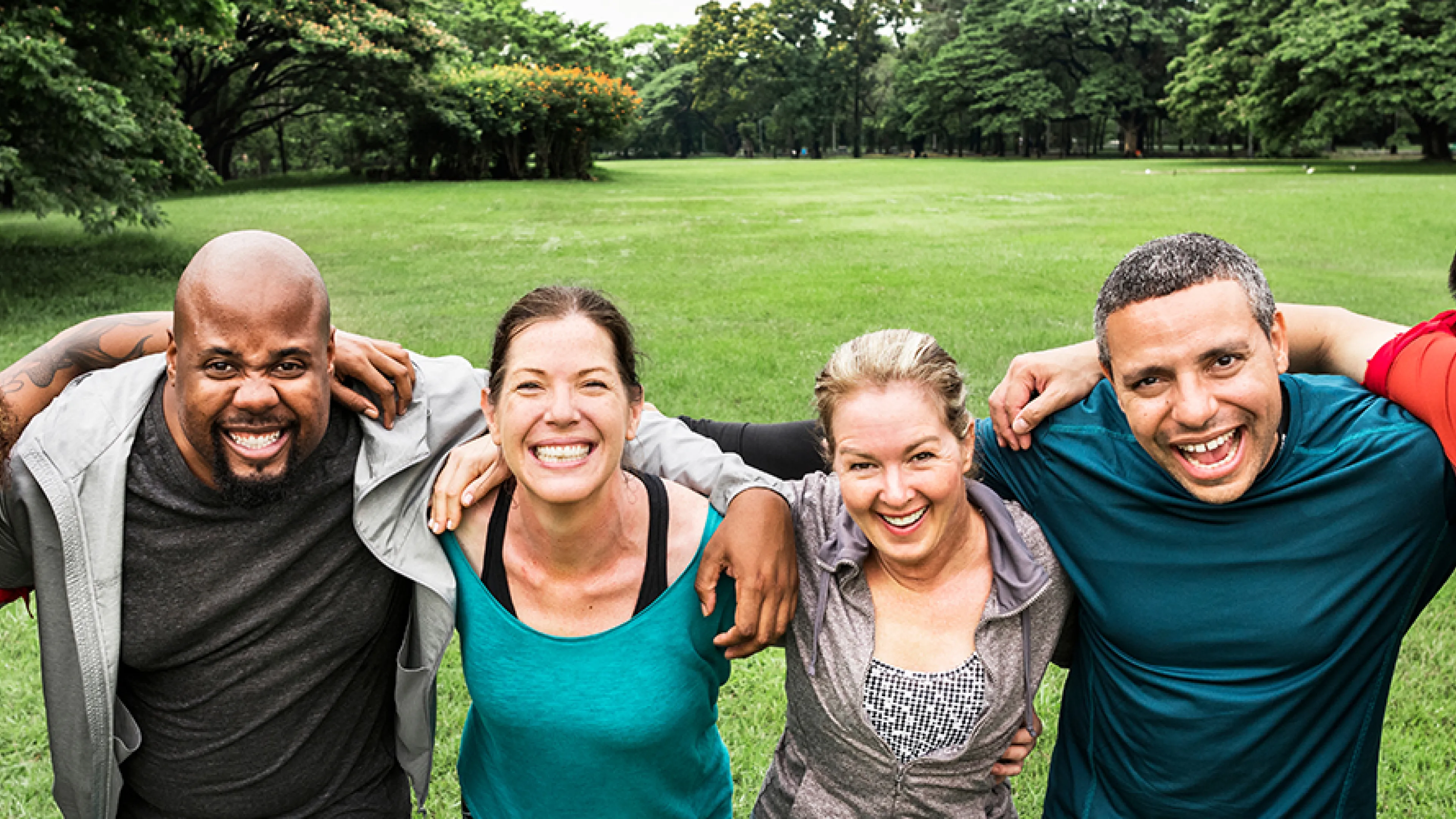 diverse group taking a break from outdoor fitness for a photo