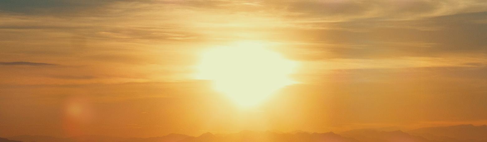 white and orange sunset over mountains