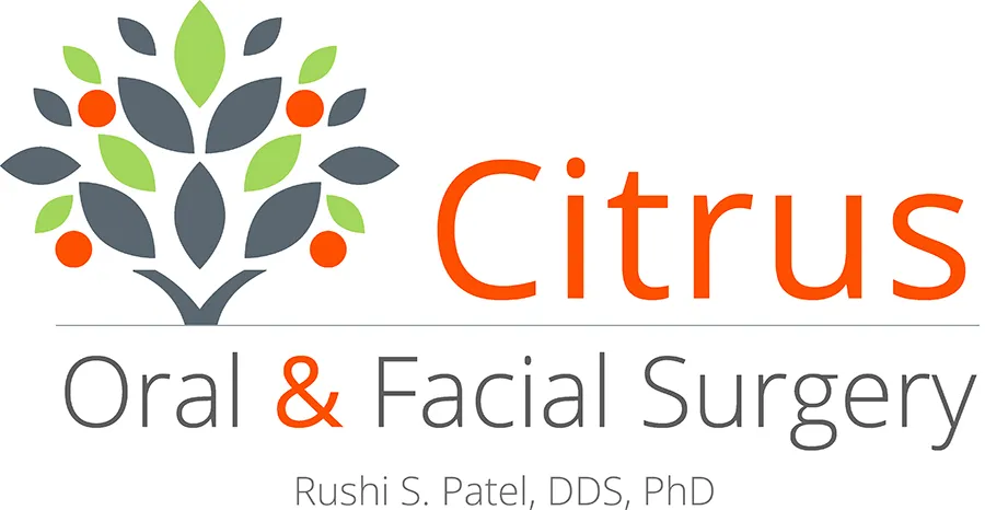Logo for Citrus Oral &amp; Facial Surgery - multi-colored tree then the name of the Surgery Center. Rushi S.Patel, DDS, PHD