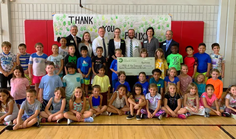 YMCA Campers pose with check donated by Publix Charities