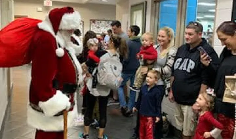 Santa visits the Greater Palm Harbor Y 