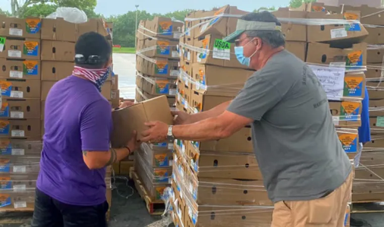 James P. Gills Y volunteers handle food