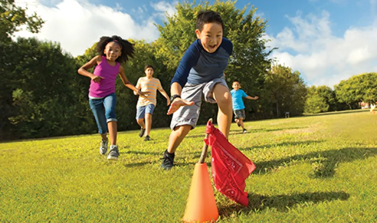 kids running in field playing games