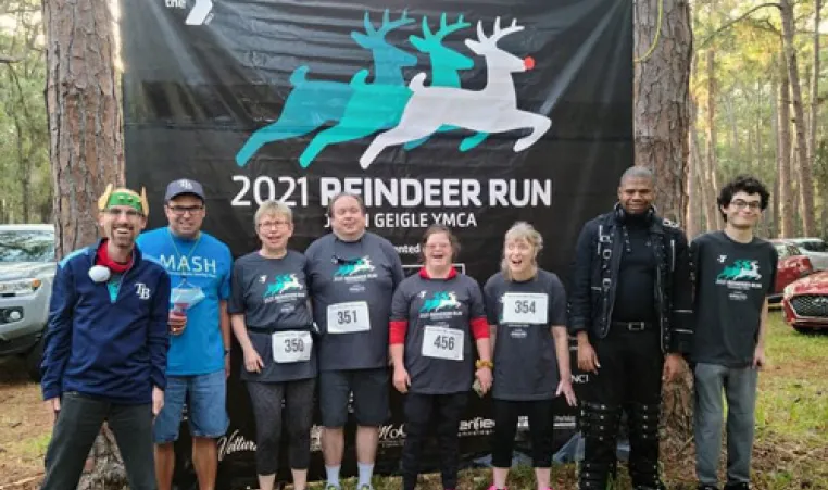 MASH group in woods, ready to run in the 2021 Reindeer Run race