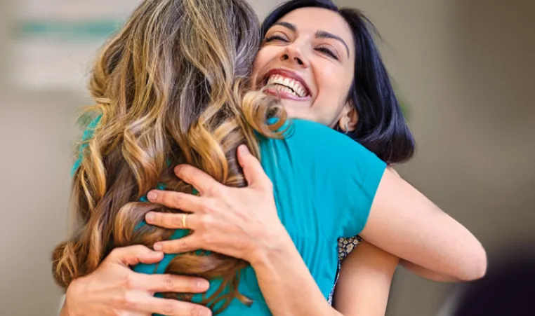 Two women embracing at the Y