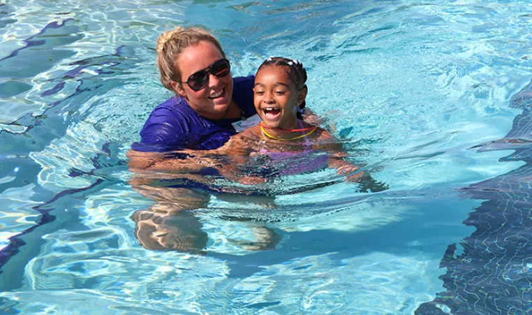 Instructor and child in pool for SAW