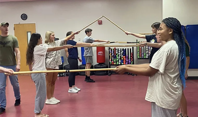 Students participating in the Stick Club at the John Geigle YMCA