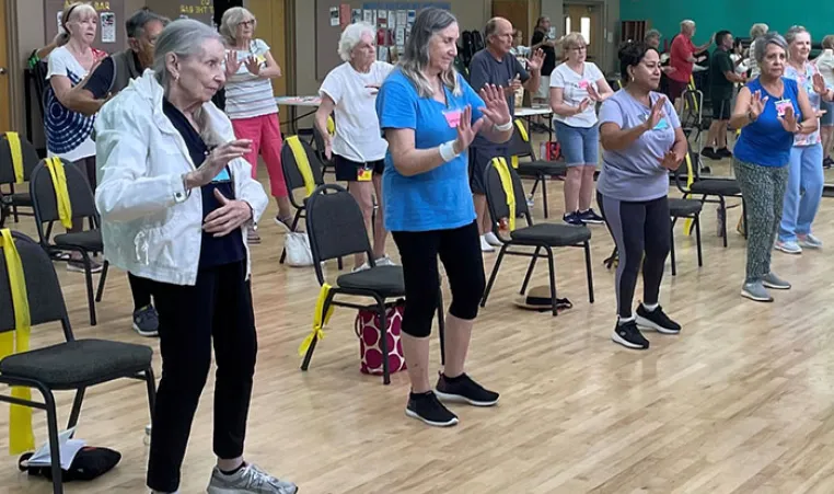 Seniors practicing Tai Chi indoors at the Hernando County YMCA.