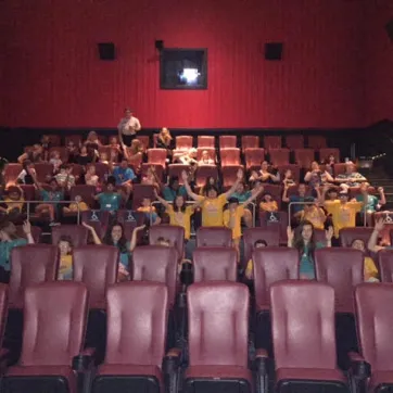 Camp COAST members pose at the movie theatre 