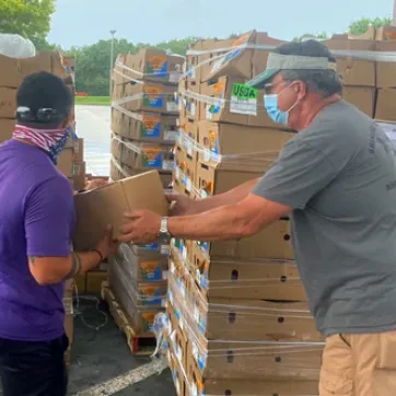 James P. Gills Y volunteers handle food