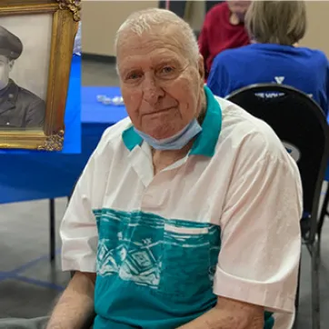 101 year old veteran smiling at birthday celebration at the Y