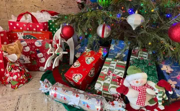 Gifts under decorated Christmas tree.