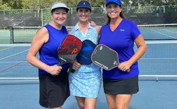 Kat Orr, Kelly Westbrook and Robbie McKee pose for a photo at the John Geigle YMCA pickleball courts. 