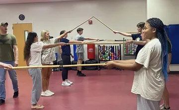 Students participating in the Stick Club at the John Geigle YMCA